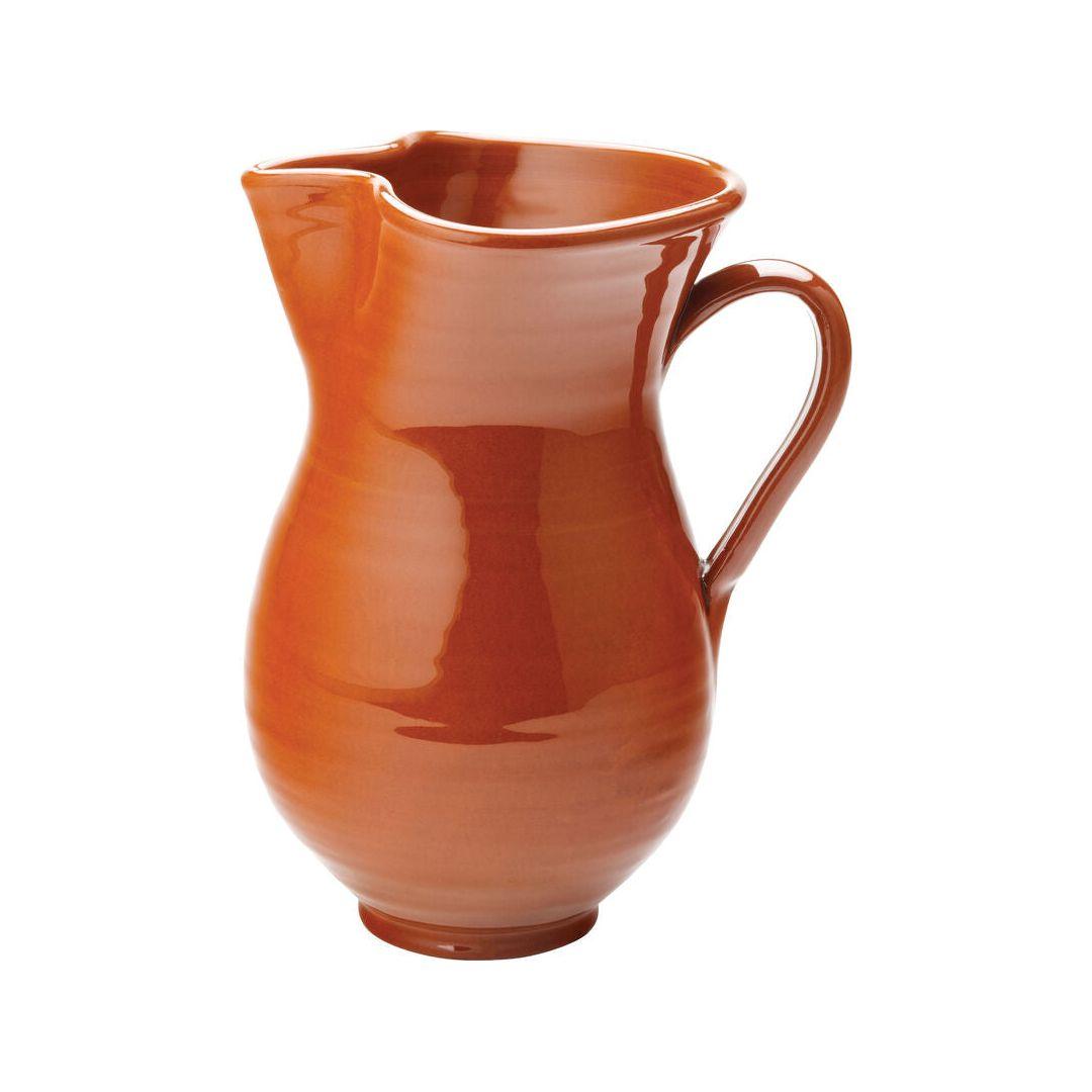 An orange pitcher on a white background.