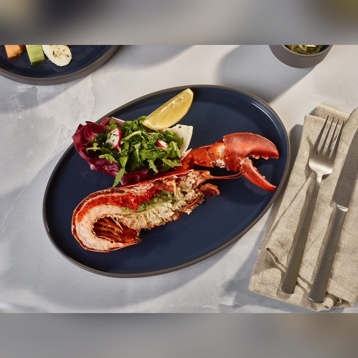 Kava blue porcelain oval plate 28cm, lifestyle image