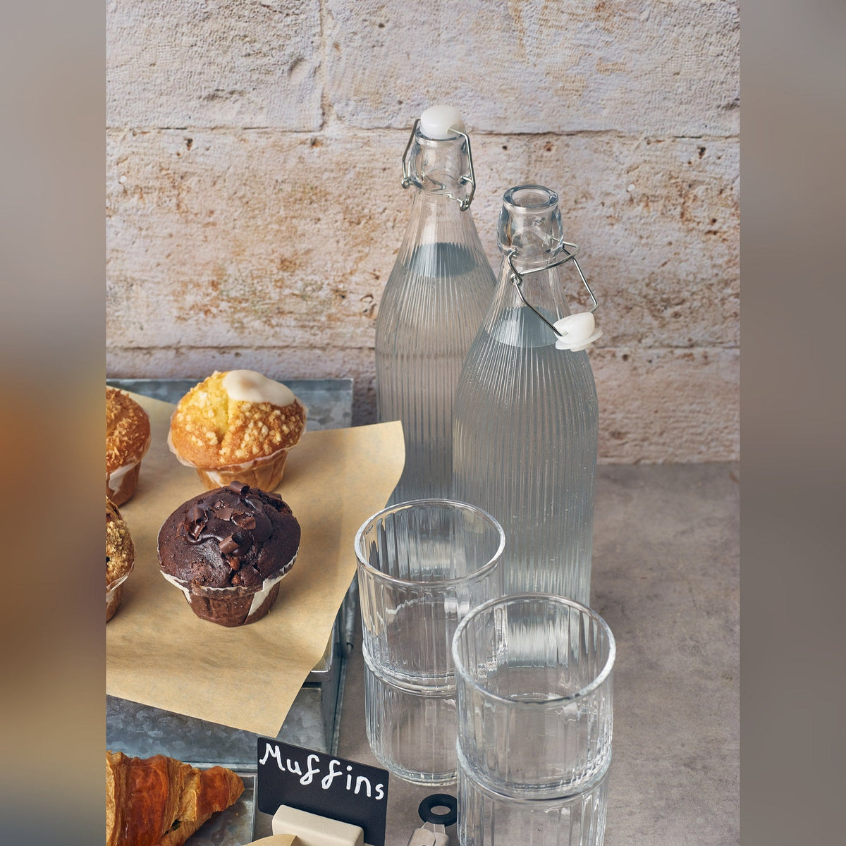 Striped glass swing top water bottle 1L, lifestyle image