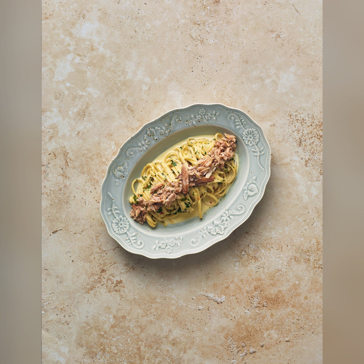 Reverie Iris porcelain oval plate 32cm with ornate embossed edges, lifestyle image