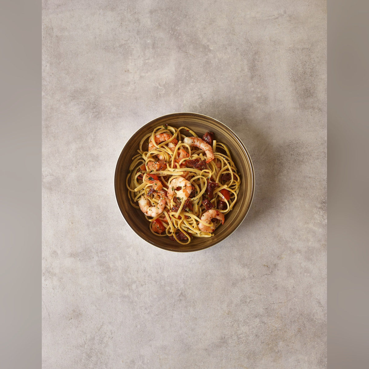 Miro grey porcelain coupe bowl 23cm with reactive style glaze, lifestyle image