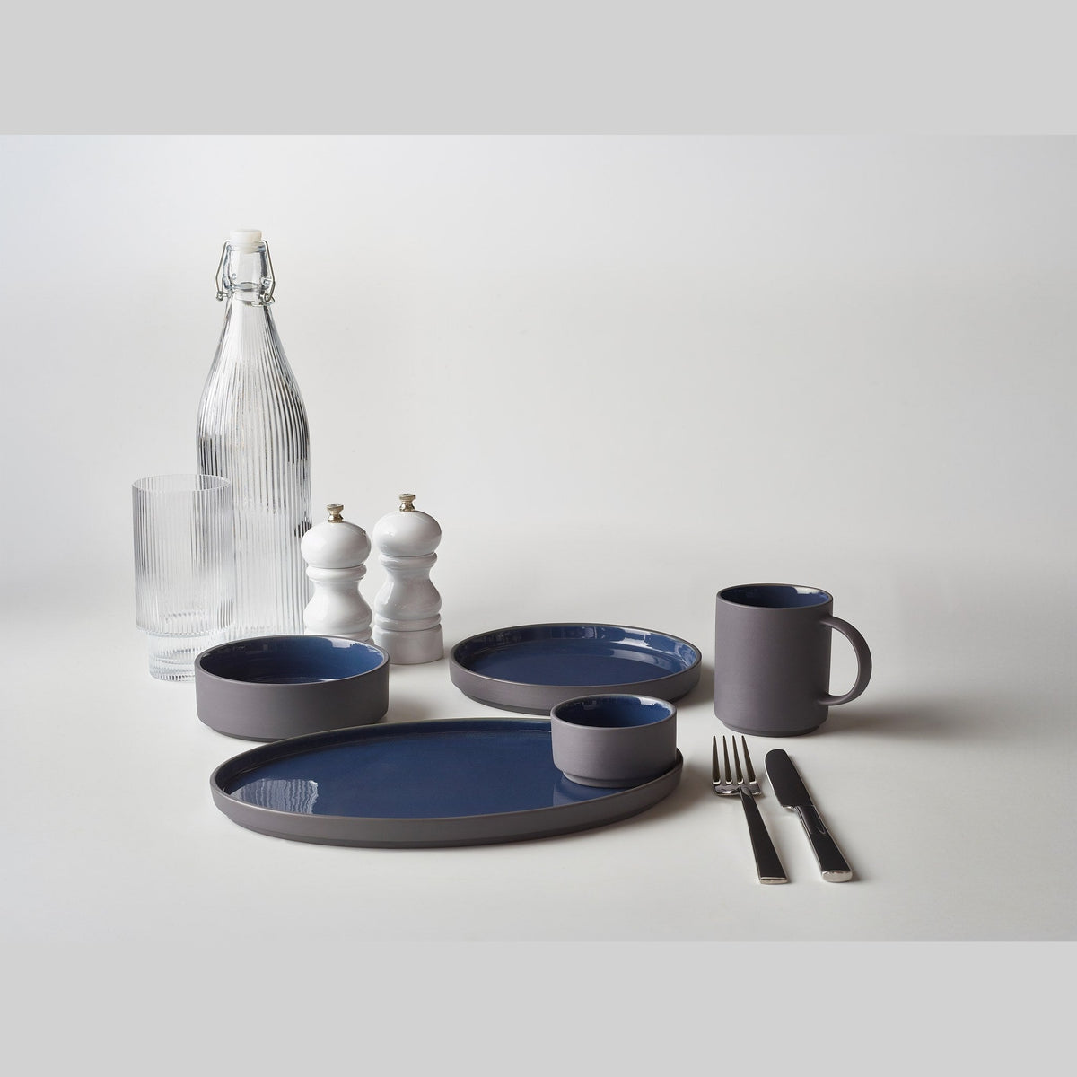 Kava blue porcelain mug 27cl with satin glaze, lifestyle image