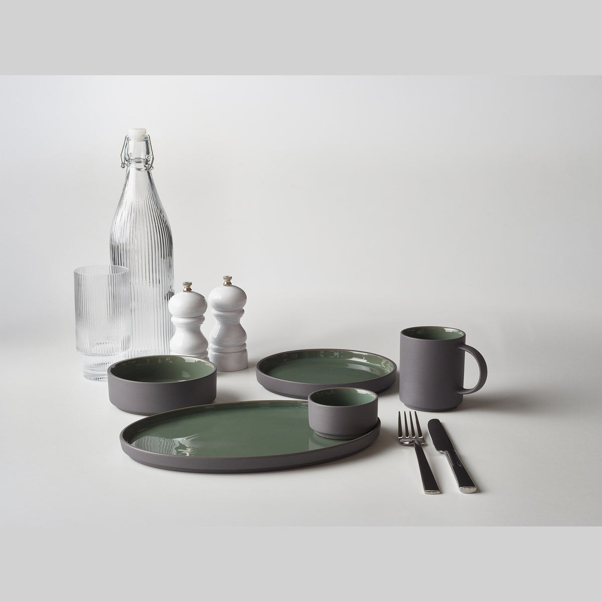 Kava green porcelain mug 27cl with satin glaze, lifestyle image