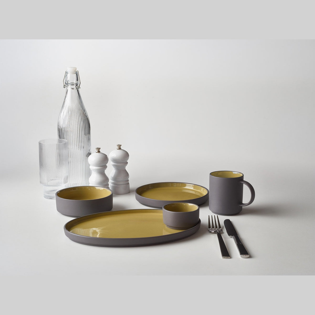 Kava yellow porcelain mug 27cl with satin glaze, lifestyle image